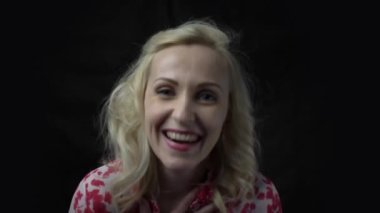 4k Positive senior woman laughs isolated on black background