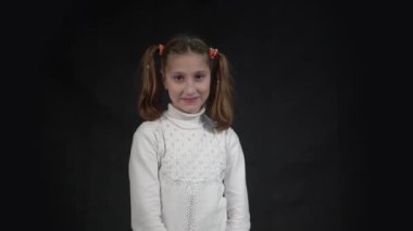 4k Portrait of charming girl looks shy and obedient, has innocent expression