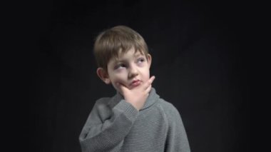 4k cute happy little boy caucasian thinking