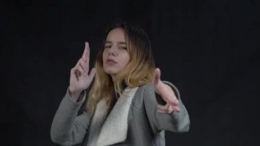 Slow Motion sweet lady hands gun isolated on black color background