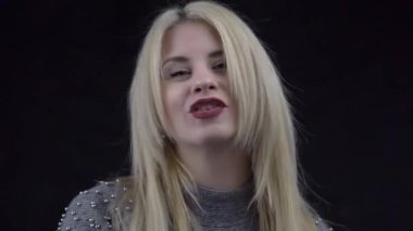 Young happy fun woman listen to music dance and singing