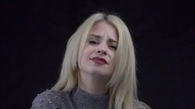 Slow Motion Portrait of young beautiful smiling and flirting  female 