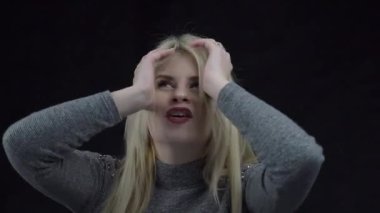 Surprised astonished young woman with open mouth. Portrait of excited girl