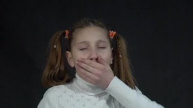 Slow Motion Young brunette girl bored yawning tired covering mouth with hand.