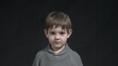 Kid think or compos on black background