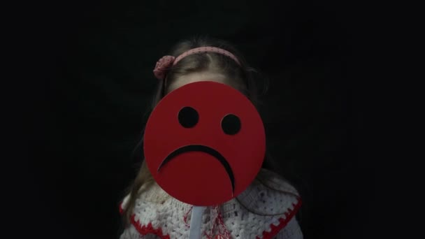 Cute Beautiful Smiling Girl Holds Cartoon Cardboard Sad Face Smile — Videoclip de stoc