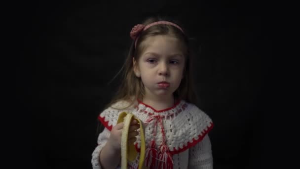 Portrait Little Cute Smiling Girl Eating Banana — Vídeo de Stock