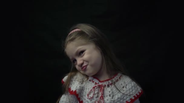 Cute Beautiful Smiling Girl Holds Cartoon Cardboard Sad Face — Stockvideo