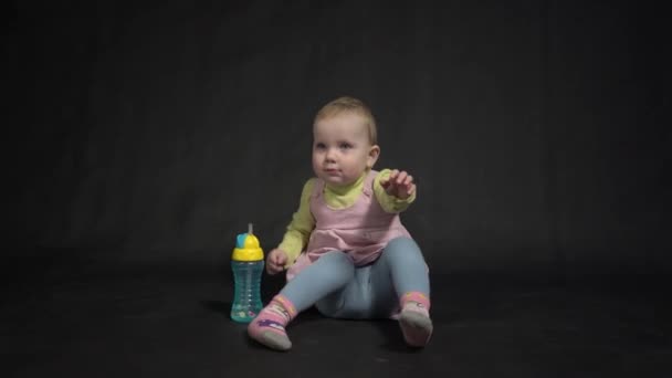 Cute Baby Water Bottle Black Background — Vídeo de stock