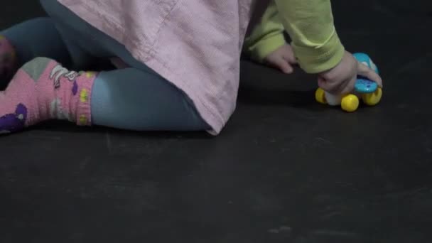 Happy Baby Girl Playing Toy Car Indoors Toddler Having Fun — Video