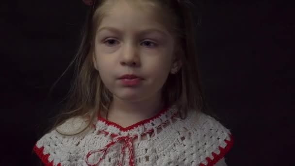 Pretty Little Girl Biting Eating Red Apple Black Background — Vídeos de Stock