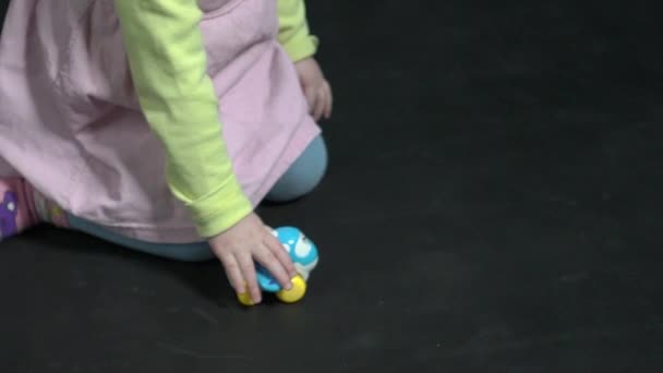 Happy Baby Girl Playing Toy Car — Vídeos de Stock