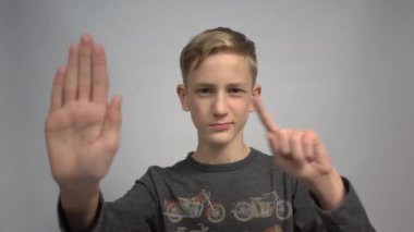 4k young caucasian man doing stop sing with palm of the hand