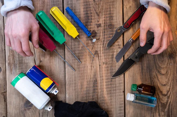 Sharpening stones and knives. The master sharpens knives in the workshop. Professional knife sharpening. Top.