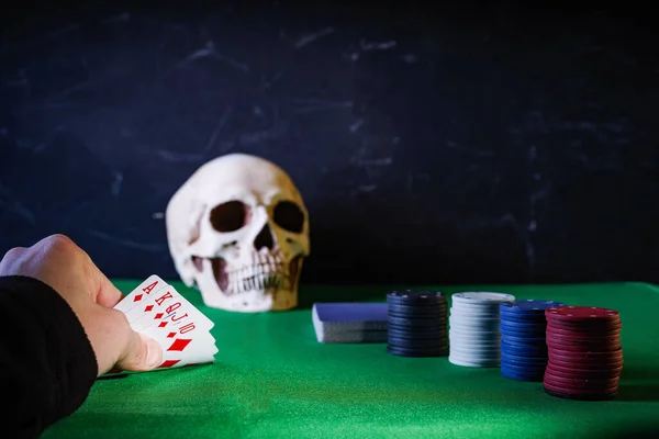 Poker game with death. Good luck with the cards. Good card combination. Passion and success. Raise the stakes.Front view.