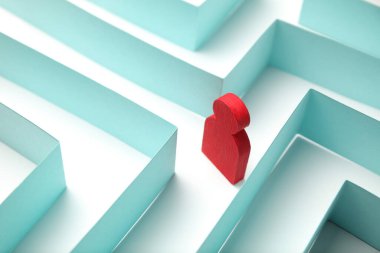 The figure of the person is looking for a way out of the maze, a solution to the problem.