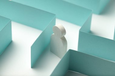 The figure of the person is looking for a way out of the maze, a solution to the problem.