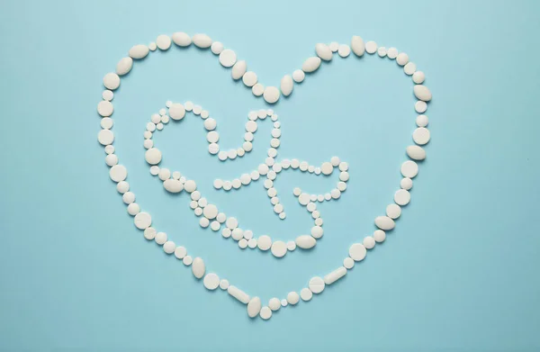 Silhouette Embryo Child People Heart White Tablets Blue Background Treatment — Φωτογραφία Αρχείου