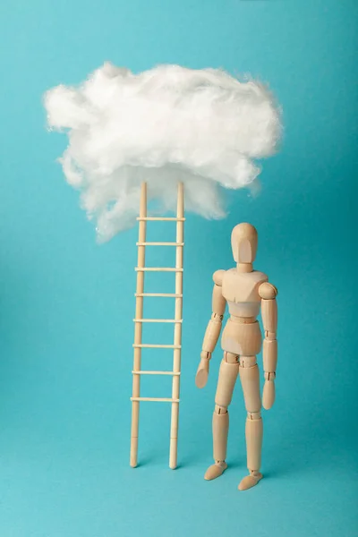 Wooden man and stepladder in clouds, career challenge and achievement. Progress and dream.