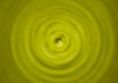 Sarı sıvıda girdap arka plan.