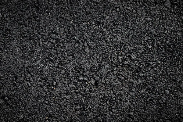 Koyu asfalt yüzey arkaplanının dokusu