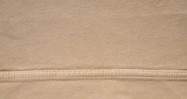 Kahverengi Bir Kumaşın Dikişli Arka Planı — Stok fotoğraf