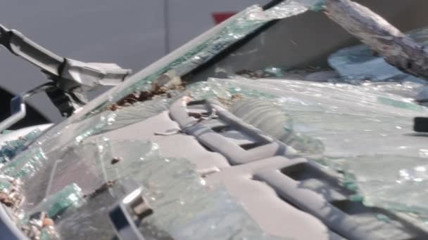 Closeup shot of the remains of a broken windshield. — Stock Video