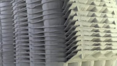 Closer look of the stack of the egg trays on the table