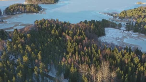 Cinematic aerial shot of the frozen sea and the small islands. — Stock Video