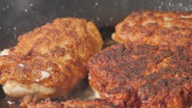 Closer look of the hot cooking oil on the frying pan.close-up.4K UHD