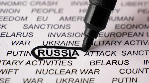 Closeup shot of RUSSIA written on white paper with a black circle around it. — Stock Photo, Image
