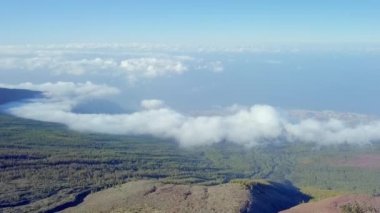A sea of thick white clouds in the sky in Tenerife Spain with the landscape view of the mountains.geology shot