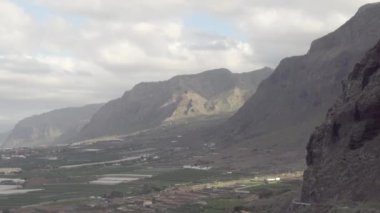 Landscape view of the mountains in Canary Islands in Tenerife Spain with the long roads on the middle.geology shot.4k