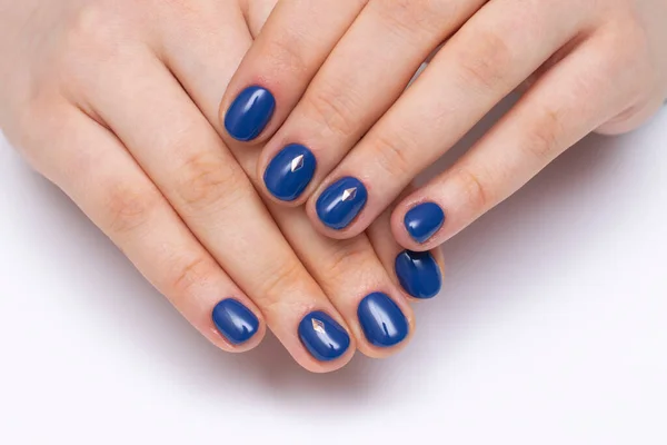 dark blue manicure with crystals on short oval nails. Indigo.