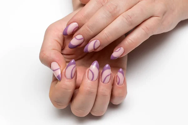 French violet manicure. Violet nails. Manicure with circles. Sharp long nails. A highlight on the nails.