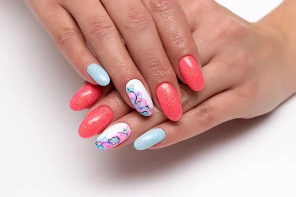 Peach, white, blue shiny manicure on oval long nails with crystals and stains on nameless nails. Summer manicure. Balloons. Abstraction on the nails. Close-up. White background.