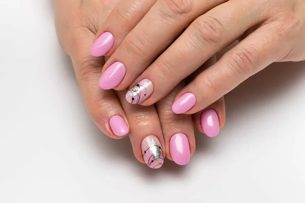 Pink manicure on oval short nails with silver foil, spider line, brush strokes. Gently pink manicure.