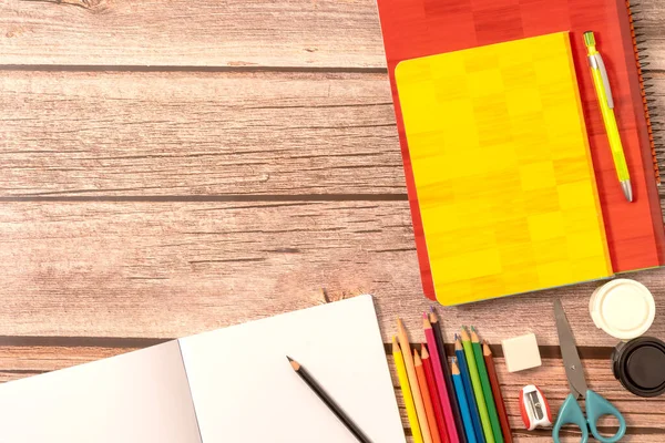 School and office supplies on wooden background. Back to school concept. Space for text. High quality photo