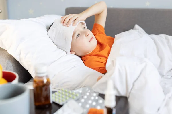 Sick Child Boy Lying Bed Covered Blanket Fever Medicine Table — Fotografia de Stock