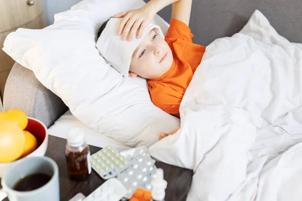 Sick Child Boy Lying Bed Covered Blanket Fever Medicine Table — Fotografia de Stock