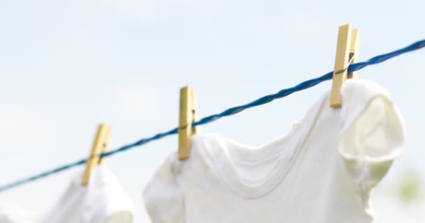 White Baby Clothes Hanging Rope Outdoors Spring Day — Wideo stockowe