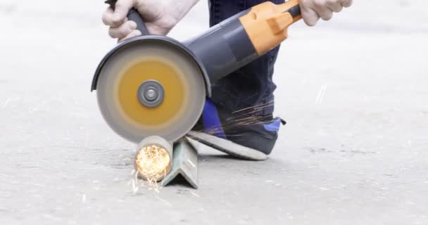 Foreman Using Angle Grinder Cutting Metal Tube Artisan Cuts Piece — Video Stock