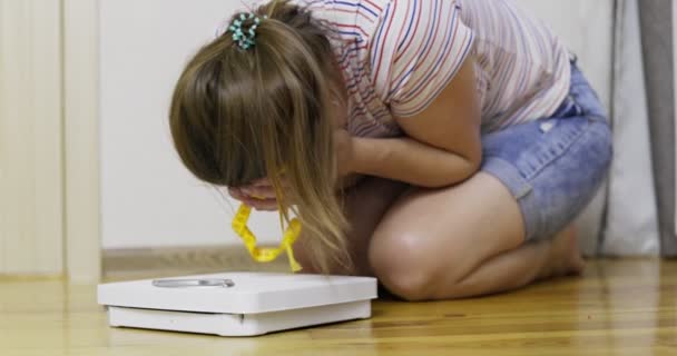 White Scale Depression Upset Sad Woman Measuring Tape Wooden Floor — Stock Video