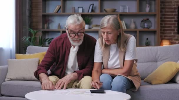 Gray Haired Retired Couple Worried Calculating Utility Bills Calculator Big — Stock Video