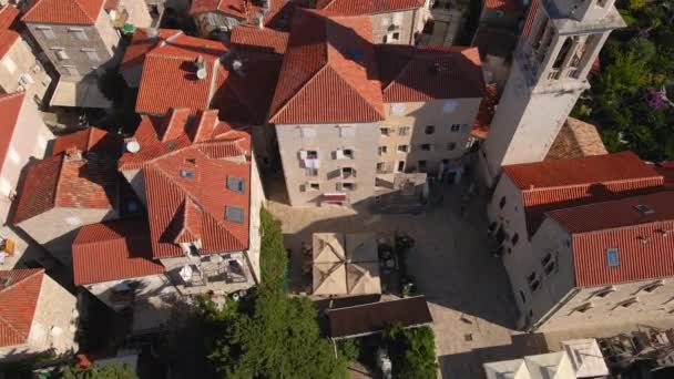 Aerial video. Slowmotion shot. The Old Town of the city of Budva popular tourist destination in Montenegro — Stock Video