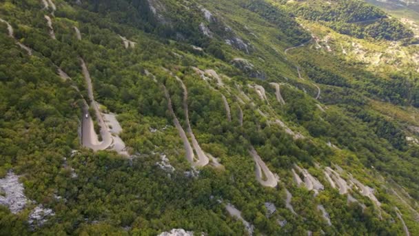 Aerial video. Slowmotion shot of the Kotor serpentine or Kotorske kanice in Montenegro. A famous road leading to the Lovchen mountain. — Vídeo de Stock