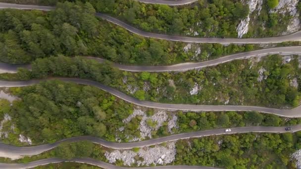 Aerial video. Slowmotion shot of the Kotor serpentine or Kotorske kanice in Montenegro. A famous road leading to the Lovchen mountain. — Stockvideo