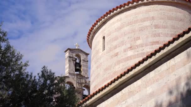A church with a bell in the Old Town of Budva. The famous tourist spot in Montenegro — Stockvideo