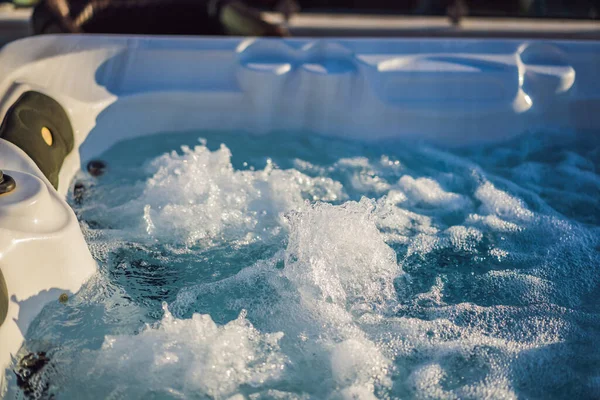 Hot tub hydromassage pool. Illuminated pool. Rest outside the city. Cottage with hydromassage pool — стоковое фото