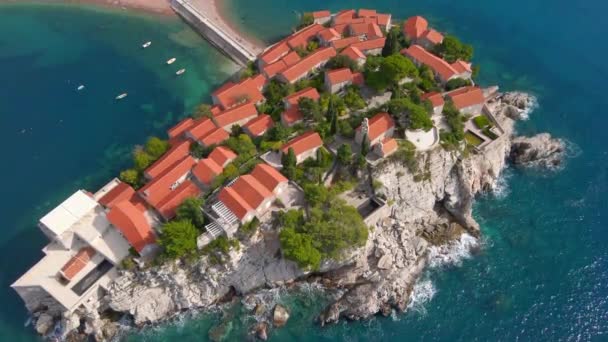 Aerial shot. Slowmotion video of the Sveti Stefan island. Famous tourist location near the city of Budva. Travel to Montenegro concept — Stockvideo